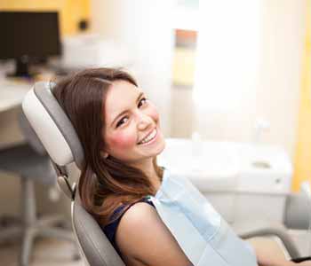 Lady sitting on a dentist chair