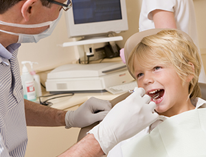 Lip Tie and Tongue Tie Dothan - Dentist in Exam Room with Young Boy in Chair